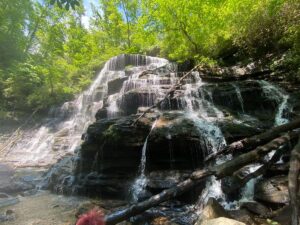 Yellow Branch Falls cascading over layered rock ledges in South Carolina